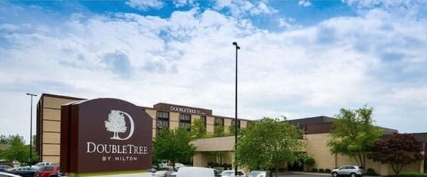 Doubletree by Hilton sign in front of a hotel